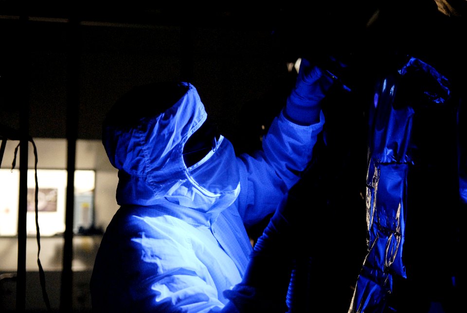 At the Astrotech facility in Titusville, Fla., technicians perform backlight inspection and cleaning on NASA's Lunar Reconnaissance Orbiter, or LRO.