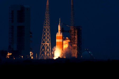 A Delta IV Heavy rocket roars to life at Space Launch Complex 37 at Cape Canaveral Air Force Station in Florida. photo