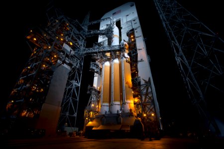 The launch gantry is rolled back to reveal NASA's Orion spacecraft mounted atop a United Launch Alliance Delta IV Heavy rocket at Cape Canaveral Air Force Station's Space Launch Complex 37. photo