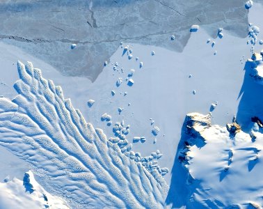 The Matusevich Glacier flows toward the coast of East Antarctica, pushing through a channel between the Lazarev Mountains and the northwestern tip of the Wilson Hills. photo