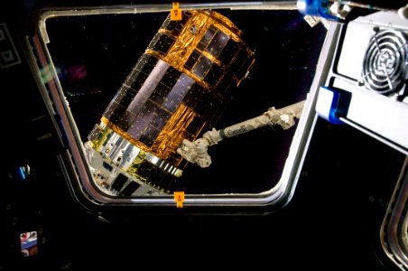 International Space Station’s Canadarm2 grapples the unpiloted Japan Aerospace Exploration Agency (JAXA) H-II Transfer Vehicle (HTV-3) as it approaches the station. July 27th, 2012. photo