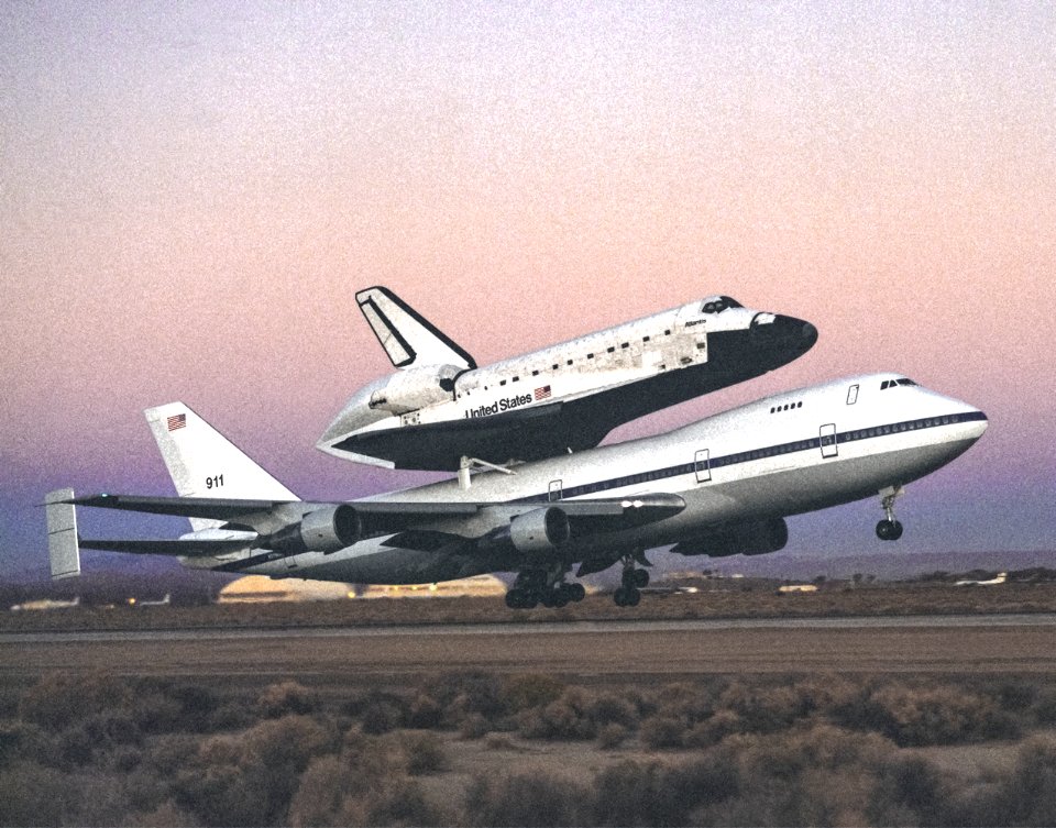 The space shuttle Atlantis atop NASA's 747 Shuttle Carrier Aircraft (SCA) during takeoff for a return ferry flight to the Kennedy Space Center from Edwards, California. 1994.