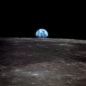 View of Earth rising over Moon's horizon taken from Apollo 11 spacecraft.