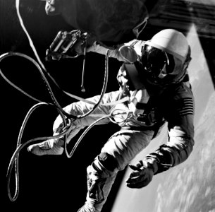 Astronaut Edward H. White II, pilot on the Gemini-Titan IV (GT-4) spaceflight, floats in the zero gravity of space outside the Gemini IV spacecraft. photo