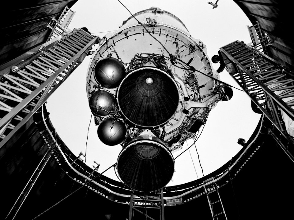 A Centaur second-stage rocket is lowered into the vacuum tank inside the Space Power Chambers at NASA’s Lewis Research Center.