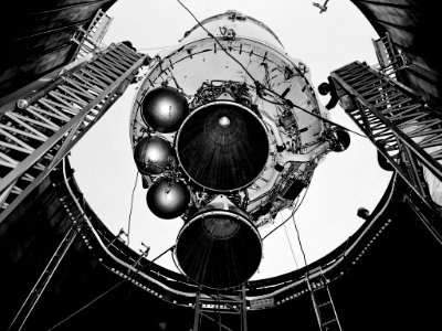 A Centaur second-stage rocket is lowered into the vacuum tank inside the Space Power Chambers at NASA’s Lewis Research Center.