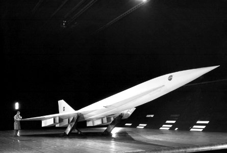 Fixed Wing Supersonic Transport in Ames 40x80 Foot Wind Tunnel. 3/4 front view of Fixed Wing SST - Lockheed SST on Ground Plane with leading edge flaps deflected in Ames 40x80 foot Wind Tunnel, May 13th,1965.