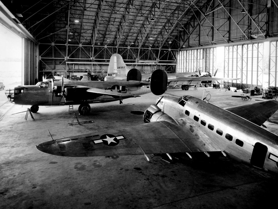 Aircraft in the Flight Research Building at the Aircraft Engine Research Laboratory: A Consolidated B–24D Liberator (left), Boeing B–29 Superfortress (background), and Lockheed RA–29 Hudson (foreground) parked inside the Flight Research Building at the National Advisory Committee for Aeronautics (NACA) Aircraft Engine Research Laboratory in Cleveland, Ohio. June 20th,1944.