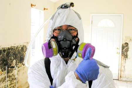 A healthcare worker investigating mold presence inside a home that had been flooded by Hurricane Katrina. Original image sourced from US Government department: Public Health Image Library, Centers for Disease Control and Prevention. Under US law this image is copyright free, please credit the government department whenever you can”.