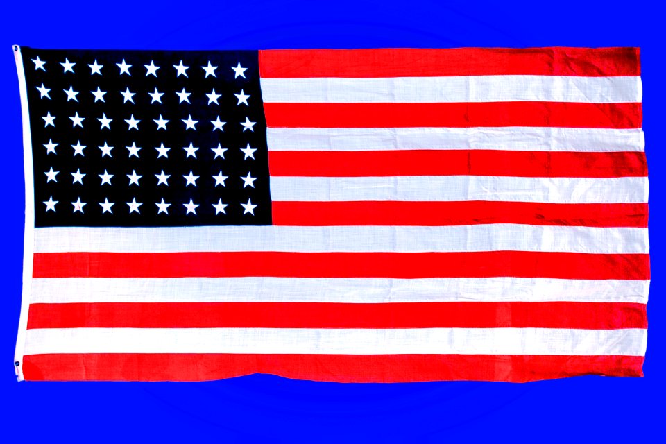 The first flag flew over Centers for Disease Control and Prevention (CDC) Headquarters in downtown Atlanta, Georgia. Original image sourced from US Government department: Public Health Image Library, Centers for Disease Control and Prevention. Under US law this image is copyright free, please credit the government department whenever you can”.