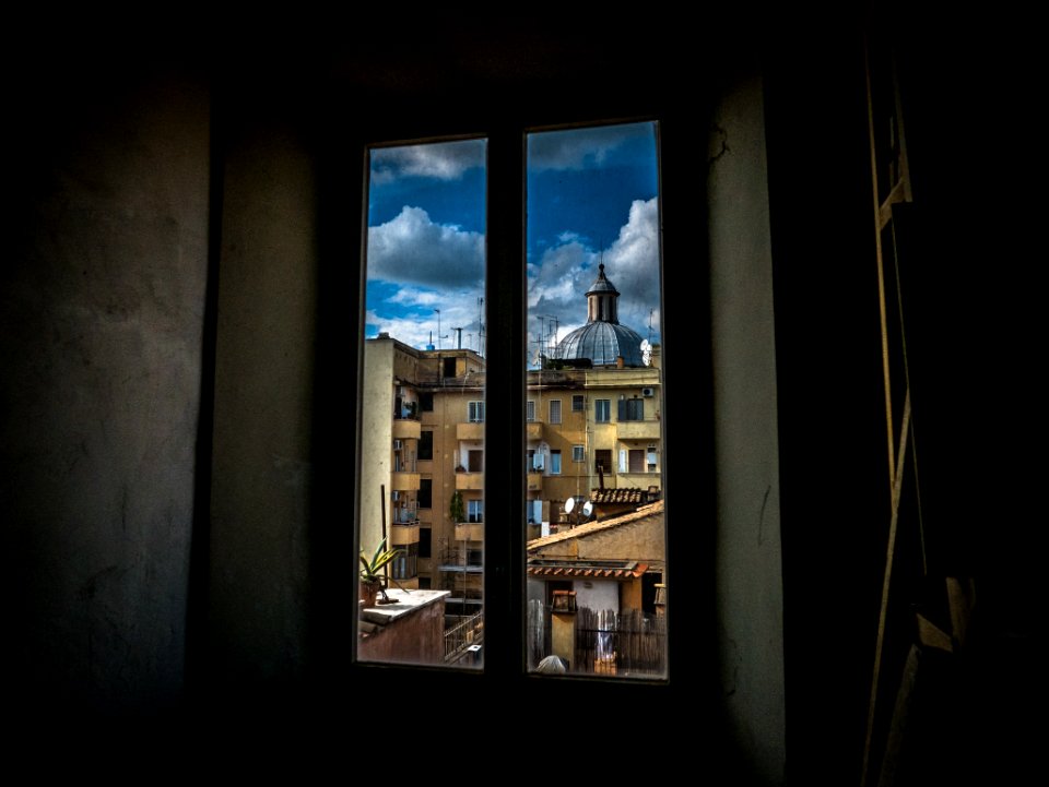 Painting Of Window With View Of Brown Buildings