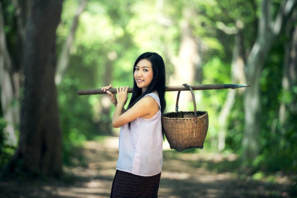 Portrait Of Smiling Woman In Forest