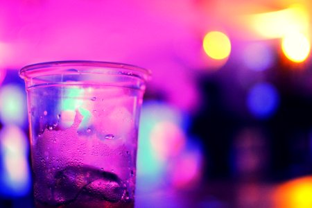Glass On Bar In Purple Light photo