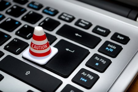 White Caution Cone On Keyboard photo