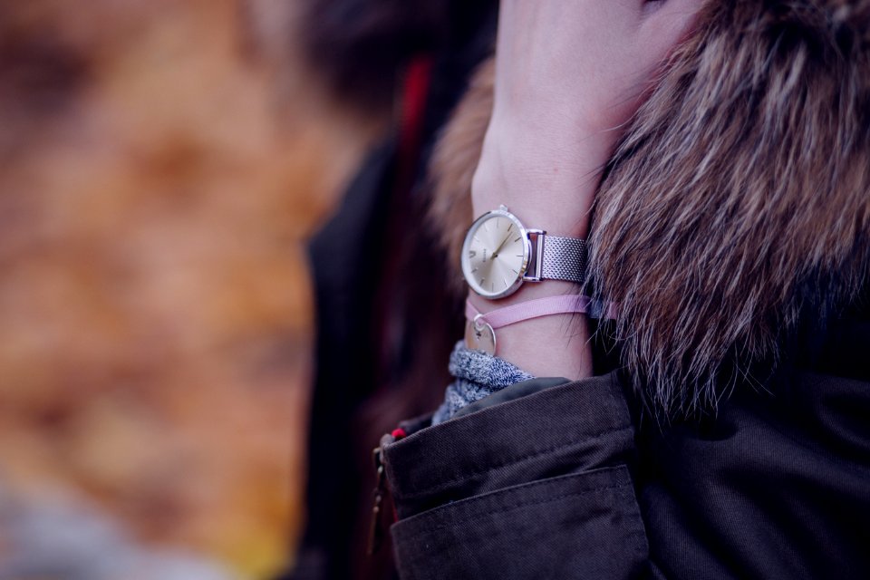 Woman In Brown Parka Jacket With Gold Round Analog Watch