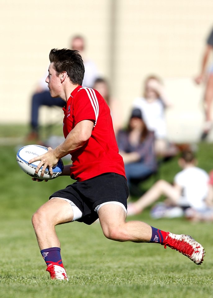 Man Playing Rugby At Daytime