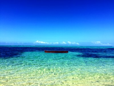 Boat In The Middle Of Atoll Photo photo