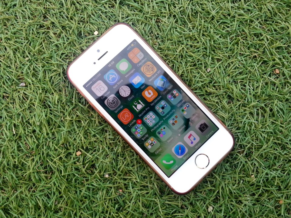 Silver Iphone On A Green Grass