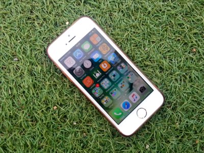 Silver Iphone On A Green Grass
