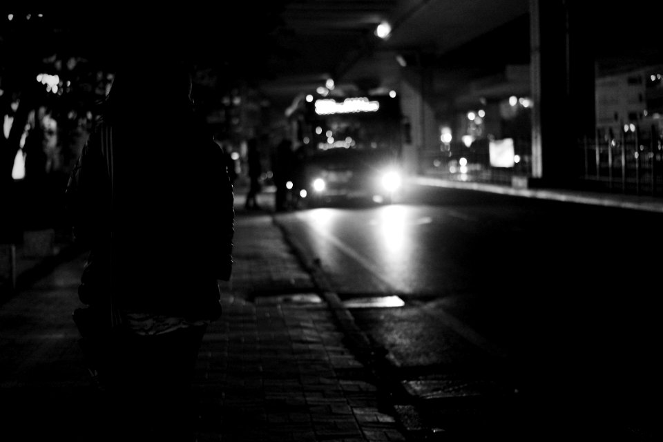 Black Bus Approaching During Nighttime