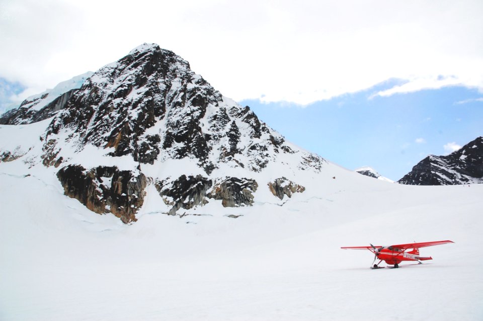 Biplane In Alpine Field