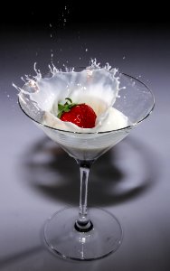 Clear Long Stem Wine Glass With Strawberry And White Liquid