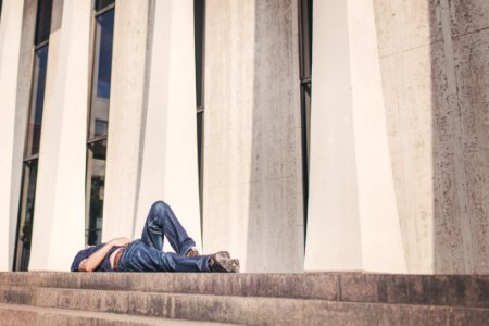 Person Laying On Outdoor Stairs