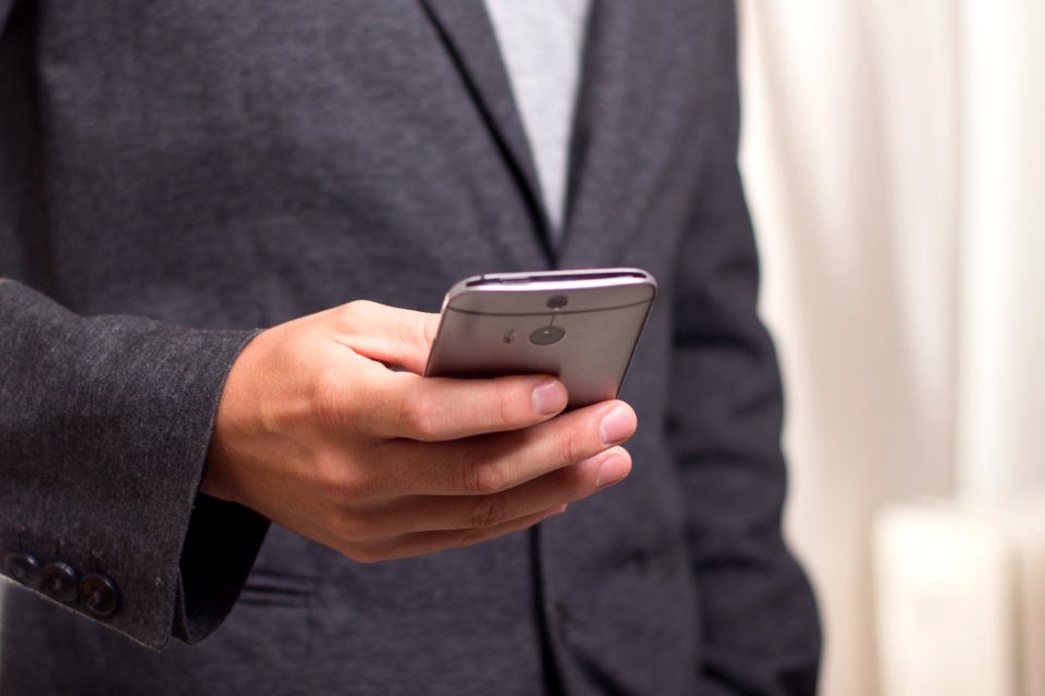 Person Holding Grey Smartphone
