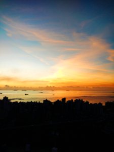 Sunset Over Silhouetted City Skyline photo