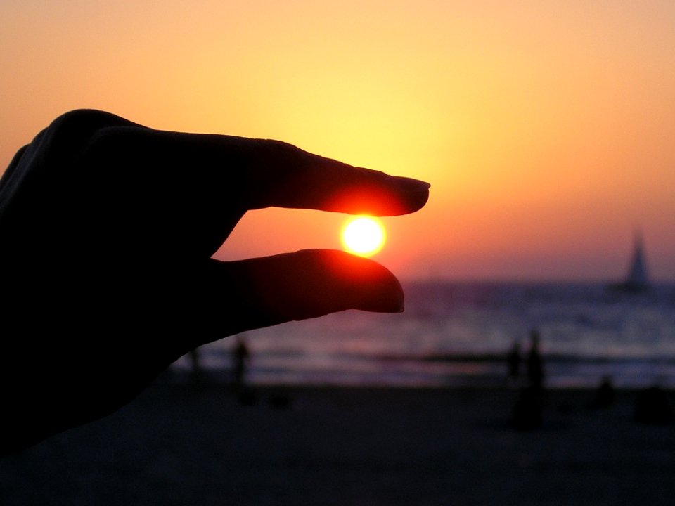 Force Perspective Photo Of Person Holding Sun