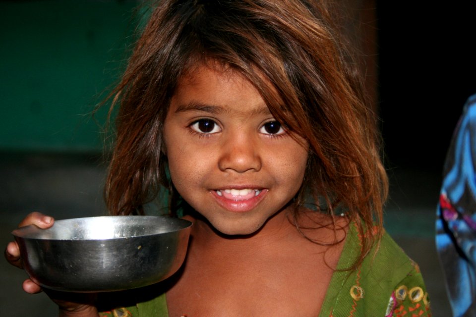 Girls On Green Shirt Holding A Silver Round Bowl