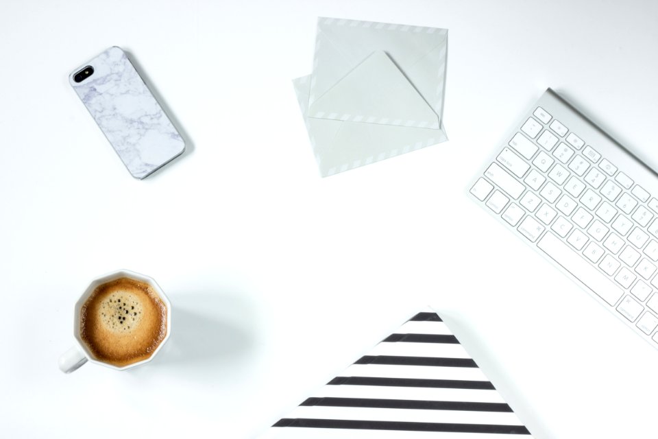 Apple Magic Keyboard Besides White Letter Envelope