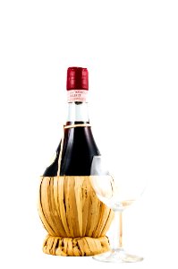 Clear Wine Glass Beside Red Wine Bottle photo