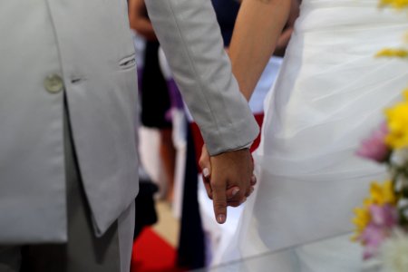 Bride And Groom Holding Hands