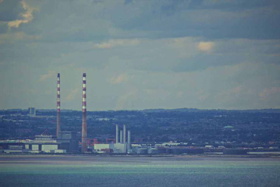 Factory Smokestacks On Horizon