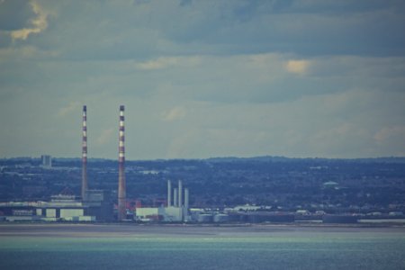 Factory Smokestacks On Horizon