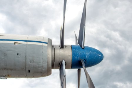 Grey Blue Plane Over White Cloudes