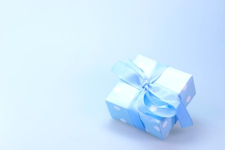 Blue And White Polka Dot Gift Box With Blue Ribbon photo