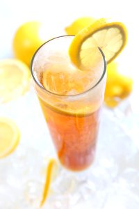 Cold Drinks Served On Clear Highball Glass With Lemon Garnish photo