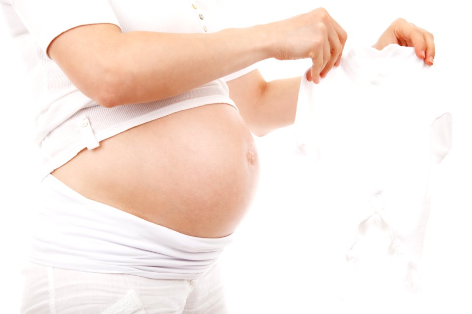 Pregnant Woman In White T Shirt And Shorts