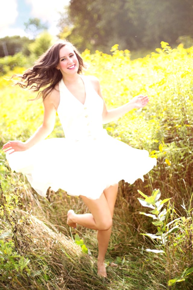 Woman In Sunny Field