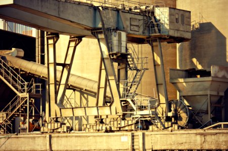 Grey Metal Bridge Near Yellow Building photo