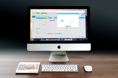 Apple Computer And Tablet On Desktop