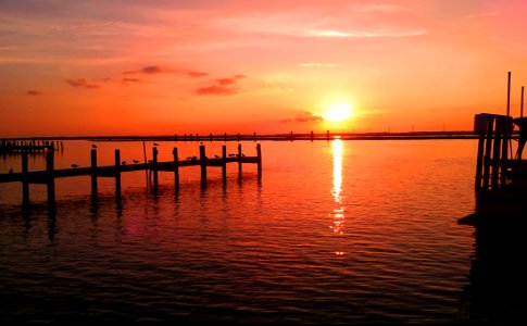 Bright Orange Sunset Reflecting On The Sea photo