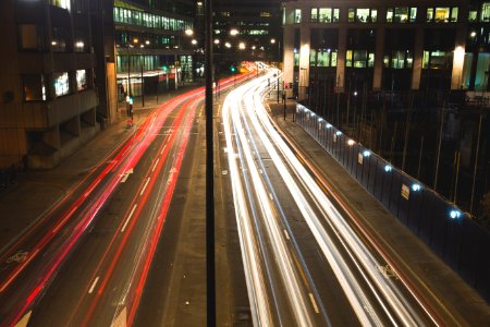Headlight And Taillight Blurs On City Street photo