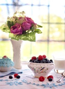Pink Flowers Near Fruit Bowl