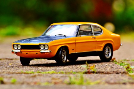 Yellow And Black Muscle Car In Tilt Shift Photography photo