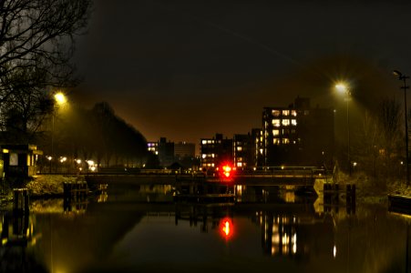 Urban Lights Reflecting In Water photo