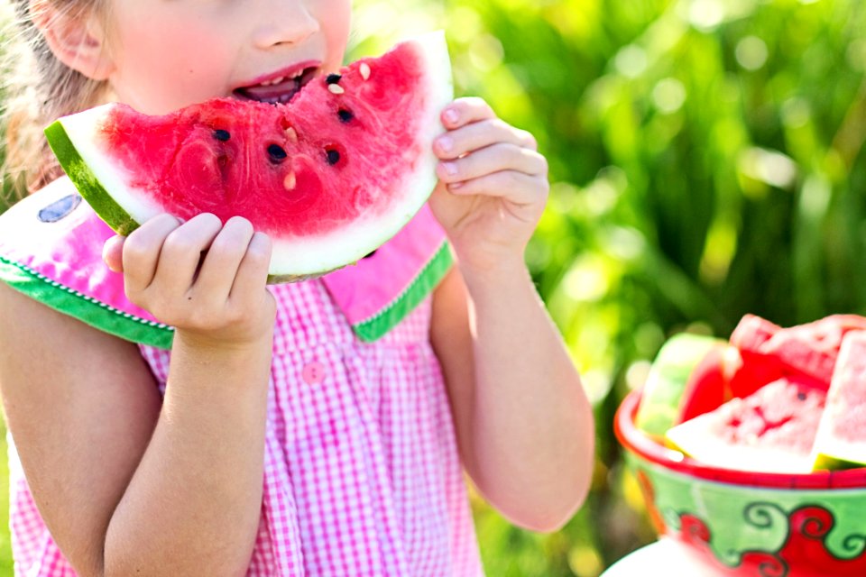 Young Girl Eating Watermelon