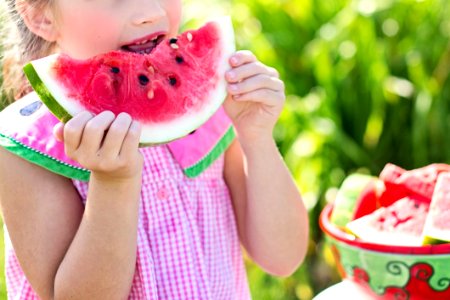Young Girl Eating Watermelon photo